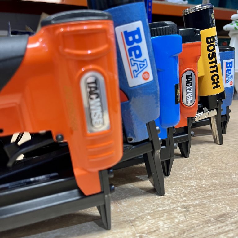 A row of staplers showing manufacturers branding, Tacwise, BeA, Bostitch