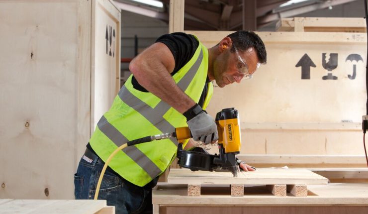 Man nailing a crate together