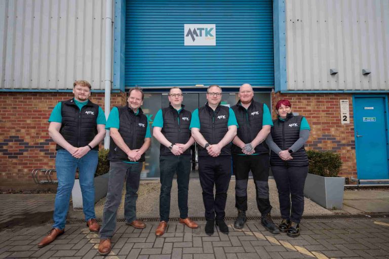 MTK Team outside warehouse 