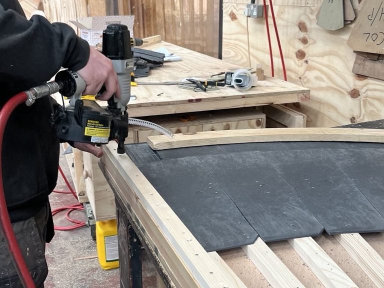 Large coil nailer being used in workshop 